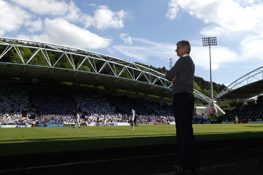Wenger will be back in the dugout. AFP