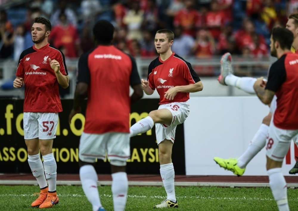 Liverpools English midfielder Jordan Rossiter (C) warms up with teammates during a training session at the Bukit Jalil Stadium in Kuala Lumpur on July 23, 2015