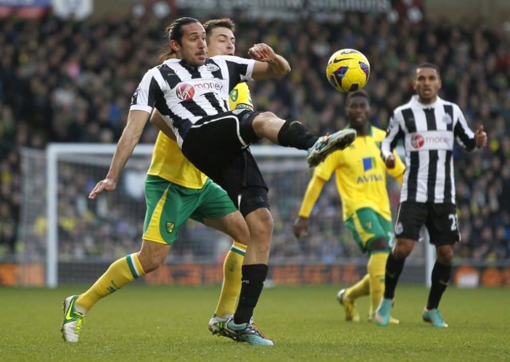 Newcastle Uniteds Argentinian midfielder Jonas Gutierrez (L) pictured during an English Premier League match against Norwich City at Carrow Road in Norwich, England, on January 12, 2013