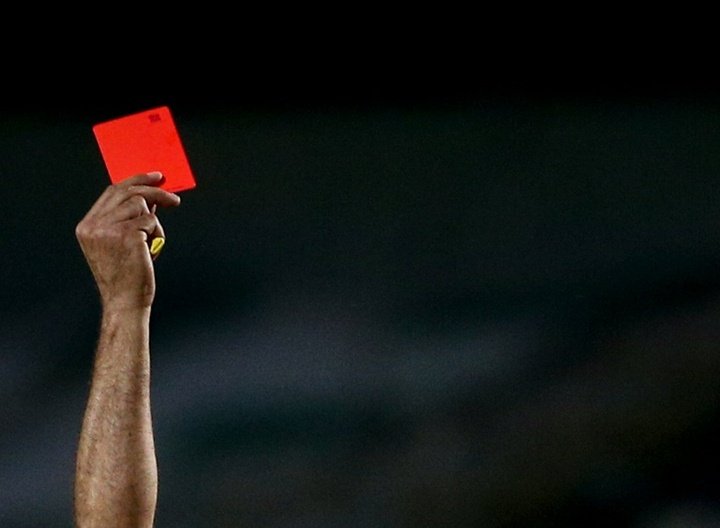You're off! Referee shows six red cards in fiery football clash