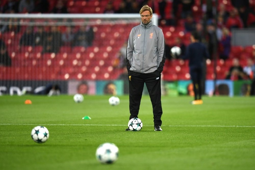 Klopp is under pressure to resolve Liverpool's defensive problems. AFP