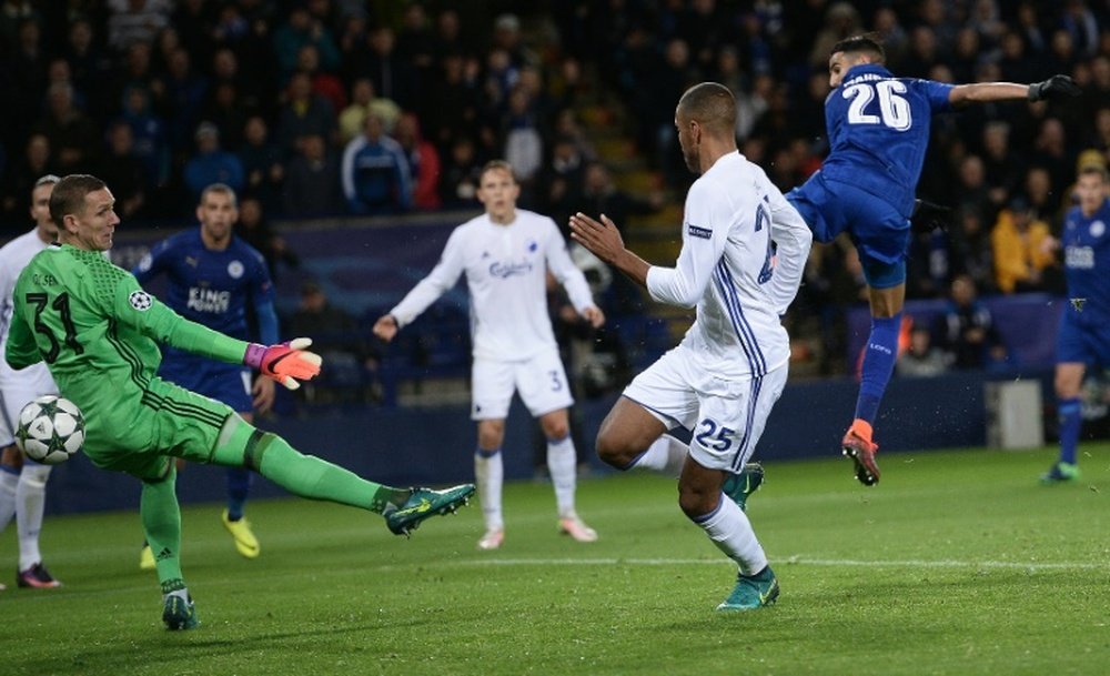 Riyad Mahrez (R) shoots past Robin Olsen (L) to scores his team's only goal. AFP