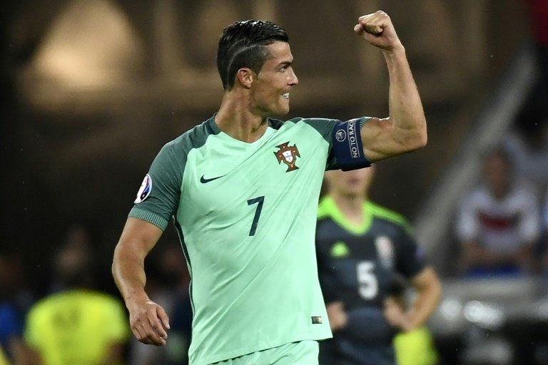 Portugals forward Cristiano Ronaldo reacts after scoring the teams first goal during the Euro 2016 semi-final match between Portugal and Wales, on July 6, 2016