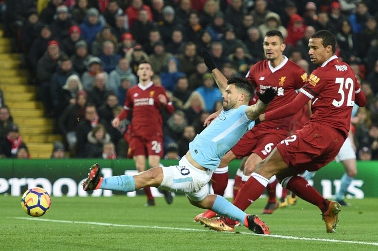 Sergio Aguero scores for Manchester City against Liverpool. AFP