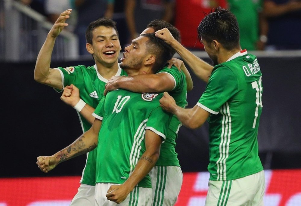 Mexicos Jesus Manuel Corona (C) celebrates scoring a goal with teammates during their Copa America Centenario Group C match, at NRG Stadium in Houston, Texas, on June 13, 2016