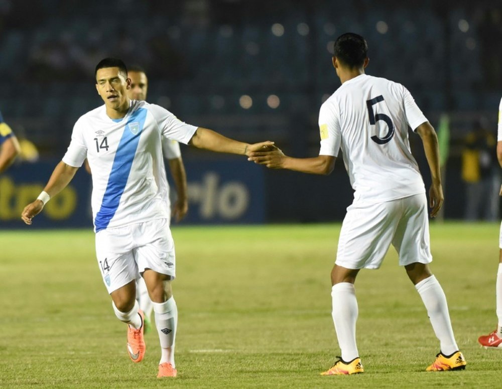 Guatamalas Rafael Morales (L) celebrates with teammate Moises Hernandez after scoring against USA in Guatemala City