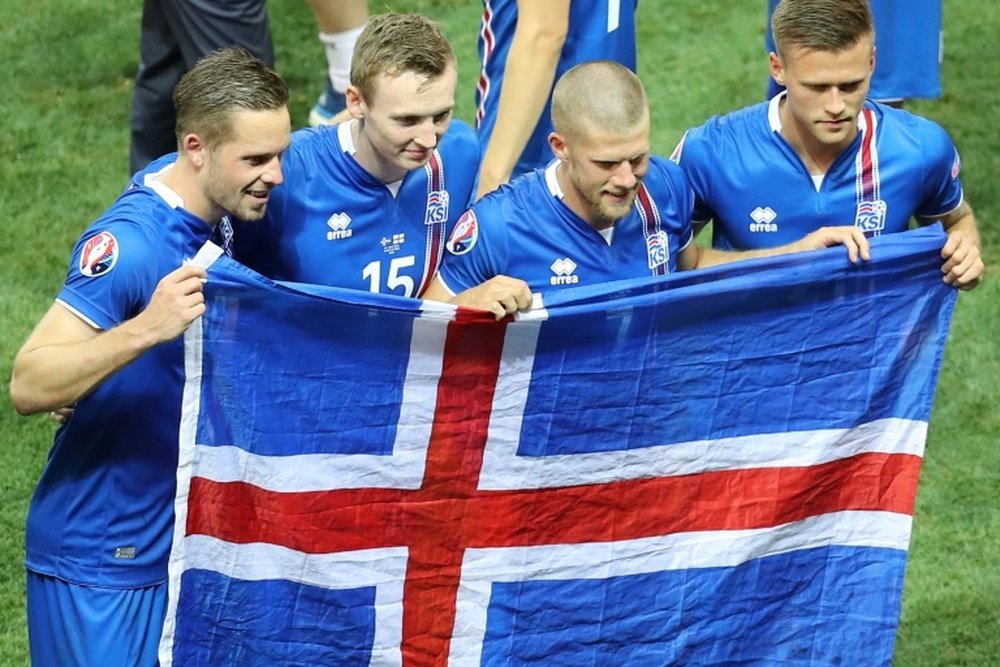 (From L) Icelands Gylfi Sigurdsson, Jon Dadi Bodvarsson, Johann Berg Gudmundsson and Arnor Ingvi Traustason celebrate their teams round of 16 2-1 win over England, during the Euro 2016 tournament, in Nice, on June 27