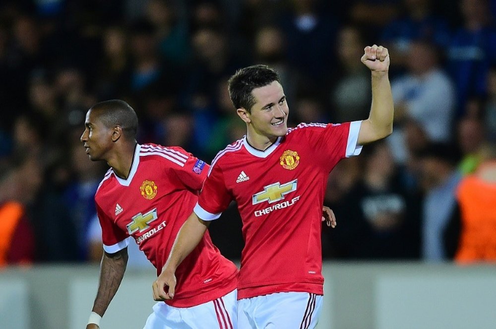 Ander Herrera (right) celebrates with Ashley Young after scoring a goal for Manchester United against Club Brugge at Jan Breydel Stadium in Bruges on August 26, 2015