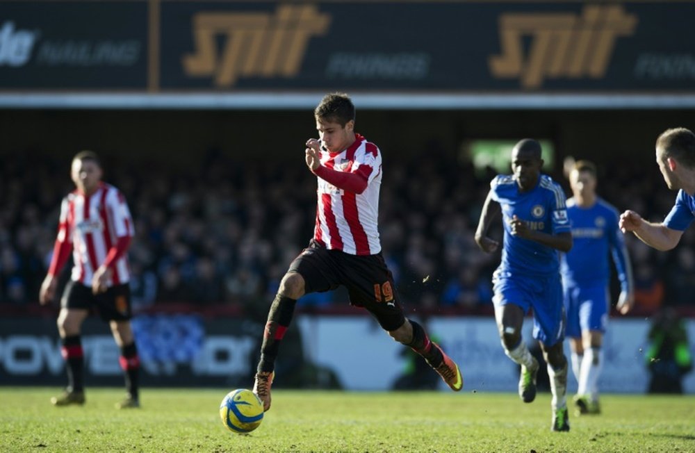 Harry Forrester on the ball for Brentford against Chelsea in an FA Cup match at Griffin Park in 2013