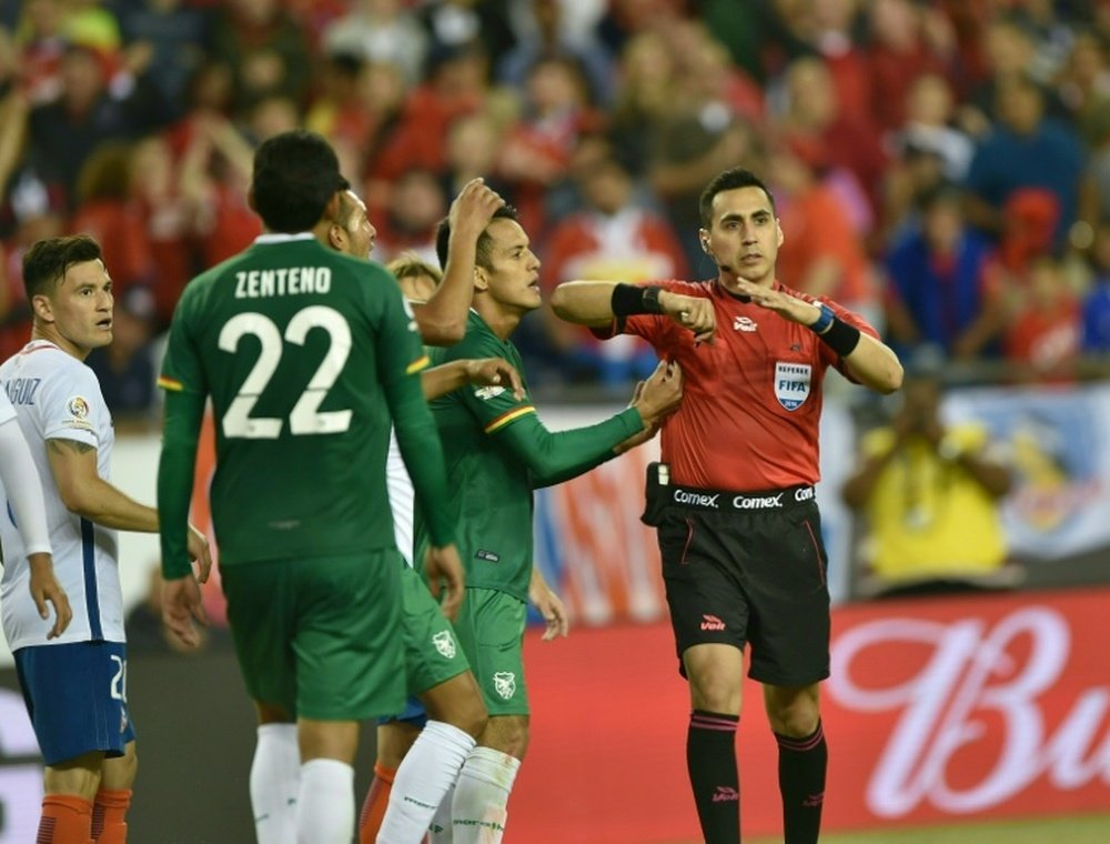 US referee Jair Marrufo awards a penalty in favour of Chile during the Copa America Centenario football tournament match against Bolivia in Foxborough, Massachusetts, United States, on June 10, 2016