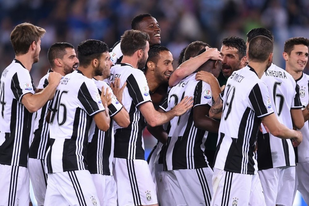 Juventus players celebrate after winning the Italian Tim Cup