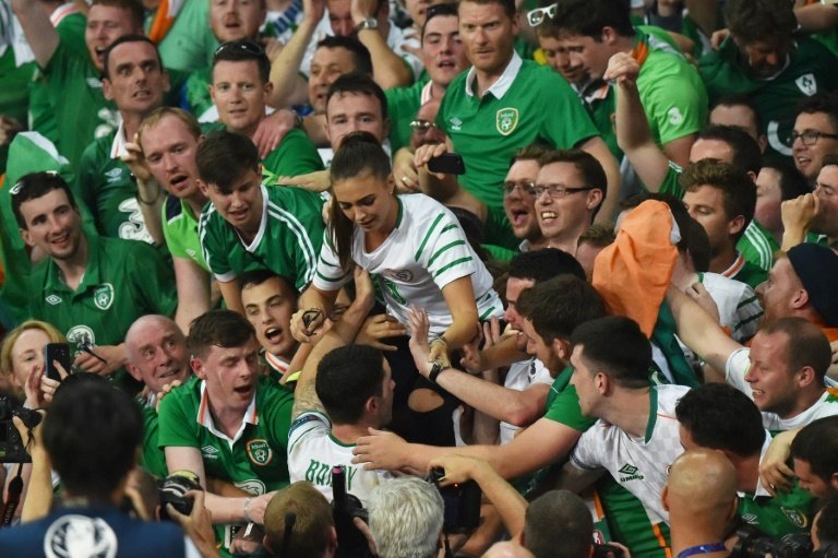 Irelands midfielder Robert Brady greets his partner Kerrie Harris after the Euro 2016 group E football match between Italy and Ireland at the Pierre-Mauroy stadium in Villeneuve-dAscq, near Lille