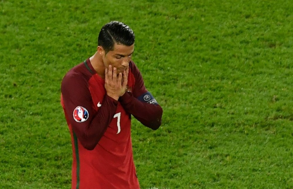 Portugals forward Cristiano Ronaldo reacts after he missed a penalty kick during the Euro 2016 match between Portugal and Austria, in Paris on June 18, 2016