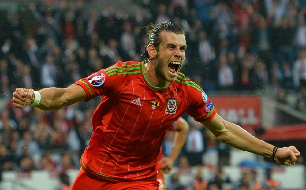 Waless midfielder Gareth Bale celebrates scoring the opening goal during the Euro 2016 qualifying match against Belgium in June
