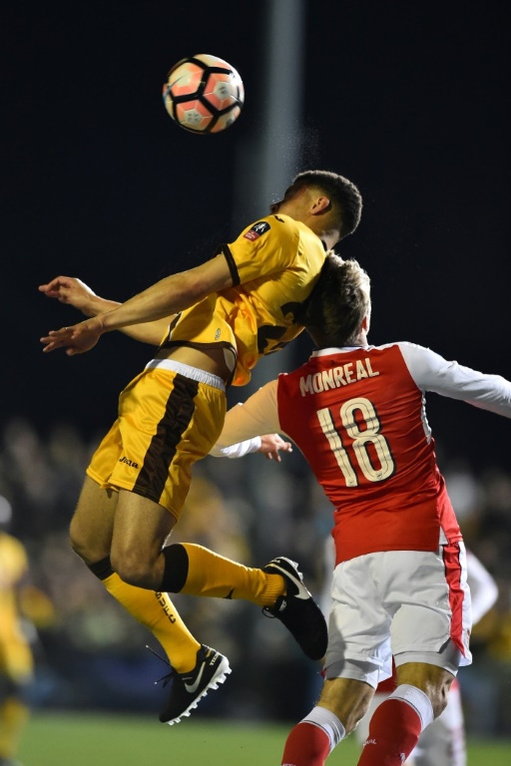 Sutton United's striker Maxime Biamou (L) vies with Arsenal's defender Nacho Monreal. AFP