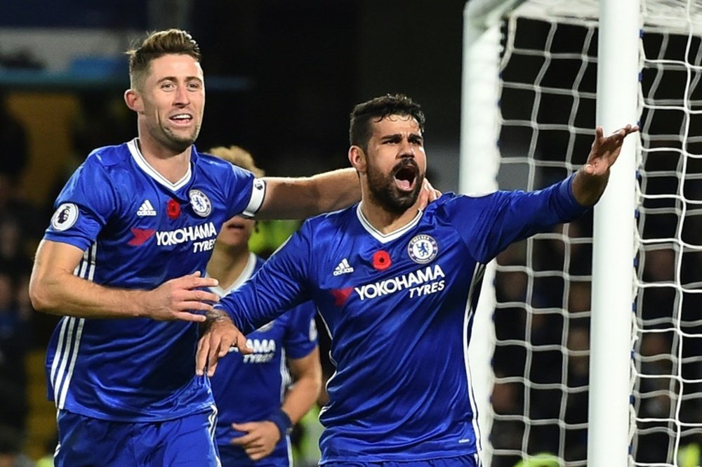Chelseas Diego Costa (R) celebrates with teammate Gary Cahill after scoring a goal during an English Premier League match against Everton, at Stamford Bridge in London, on November 5, 2016