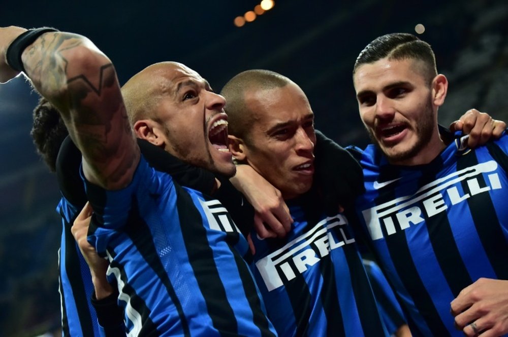 Inter Milans defender Joao Miranda (C) celebrates after scoring a goal with Mauro Icardi (R) and Felipe Melo during the Italian Serie A football match against Sampdoria at San Siro Stadium in Milan on Febrauary 20, 2016