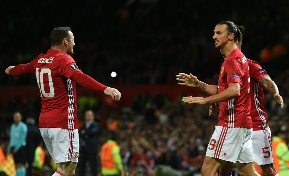 Rooney et Ibrahimovic fêtent un but de Manchester United. AFP
