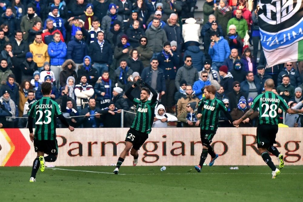 Domenico Berardi (C), pictured on February 1, 2015, will miss Sassuolos next three league outings after Serie A officials sanctioned him for kicking the opposing teams player in the stomach while lying on the ground