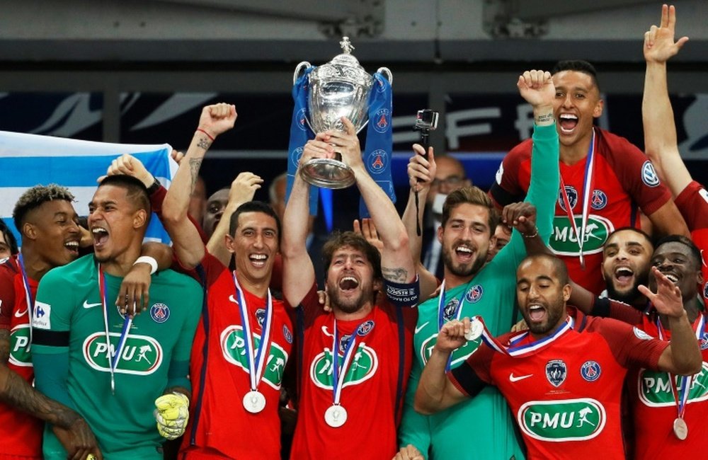 Maxwell lifted his final trophy for PSG. AFP