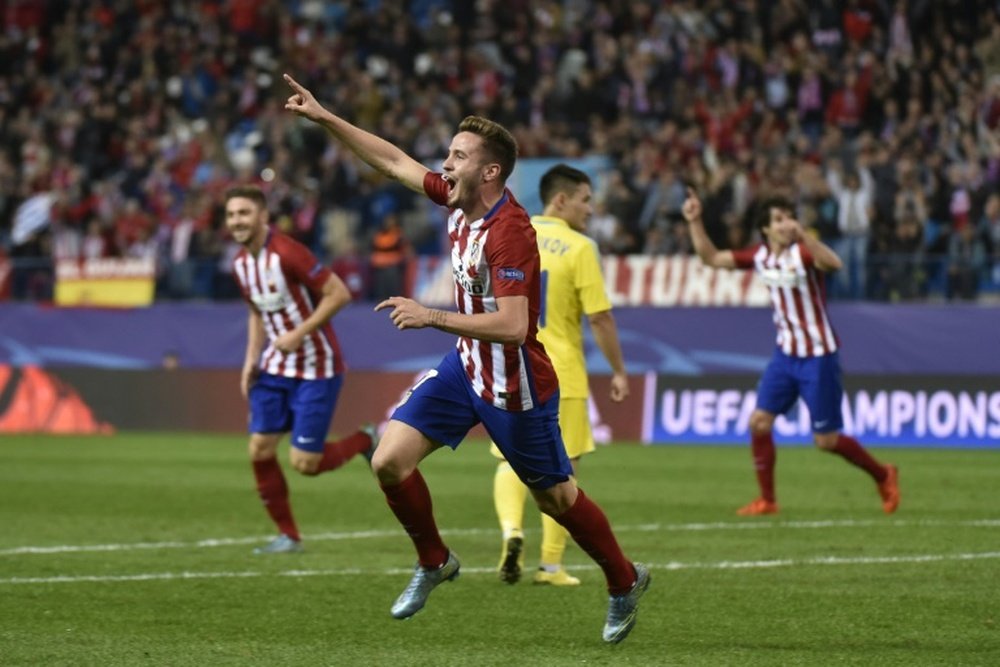 Atletico Madrids midfielder Saul Niguez celebrates scoring during the UEFA Champions League group C football match against Astana in Madrid on October 21, 2015