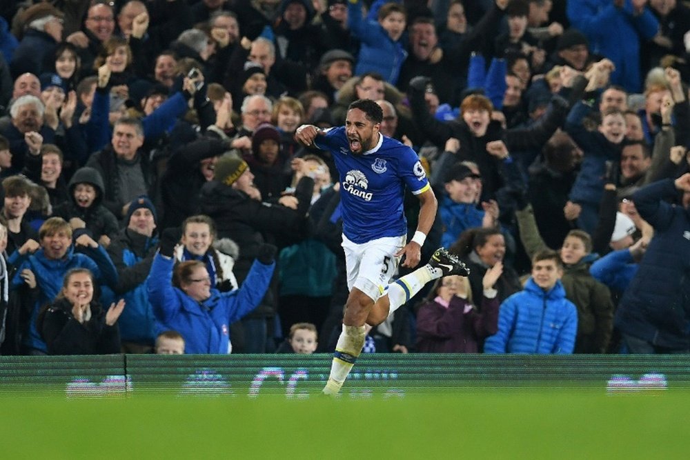 Evertons English-born Welsh defender Ashley Williams celebrates scoring his teams second goal during the English Premier League football match between Everton and Arsenal at Goodison Park in Liverpool, north west England on December 13, 2016
