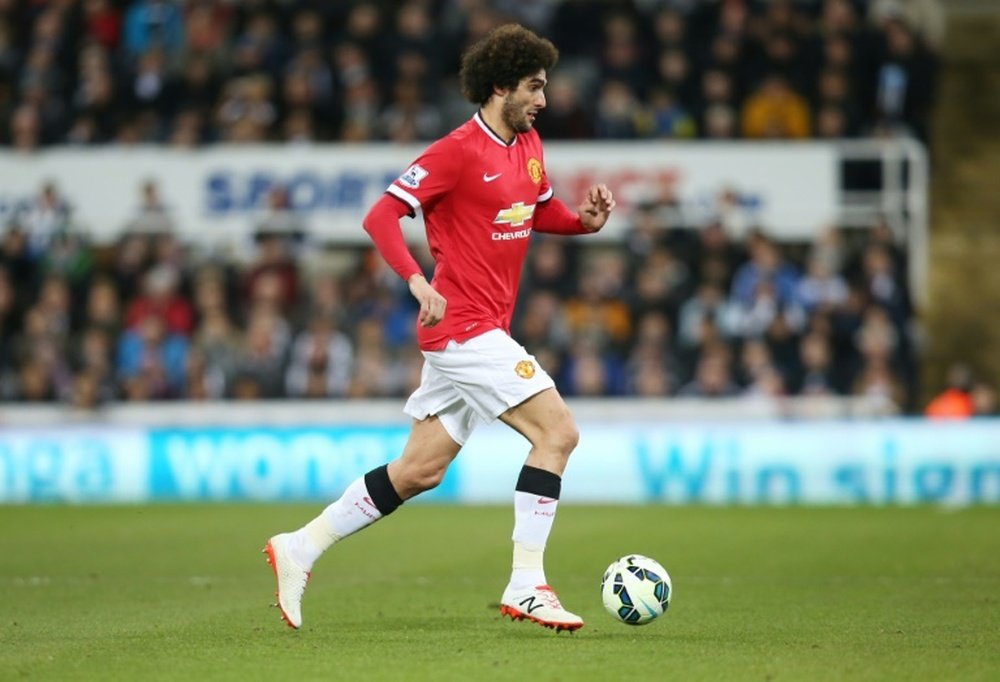 Manchester Uniteds Belgian midfielder Marouane Fellaini runs with the ball during the English Premier League football match between Newcastle and Manchester United at St James Park, Newcastle-Upon-Tyne, England on March 4, 2015