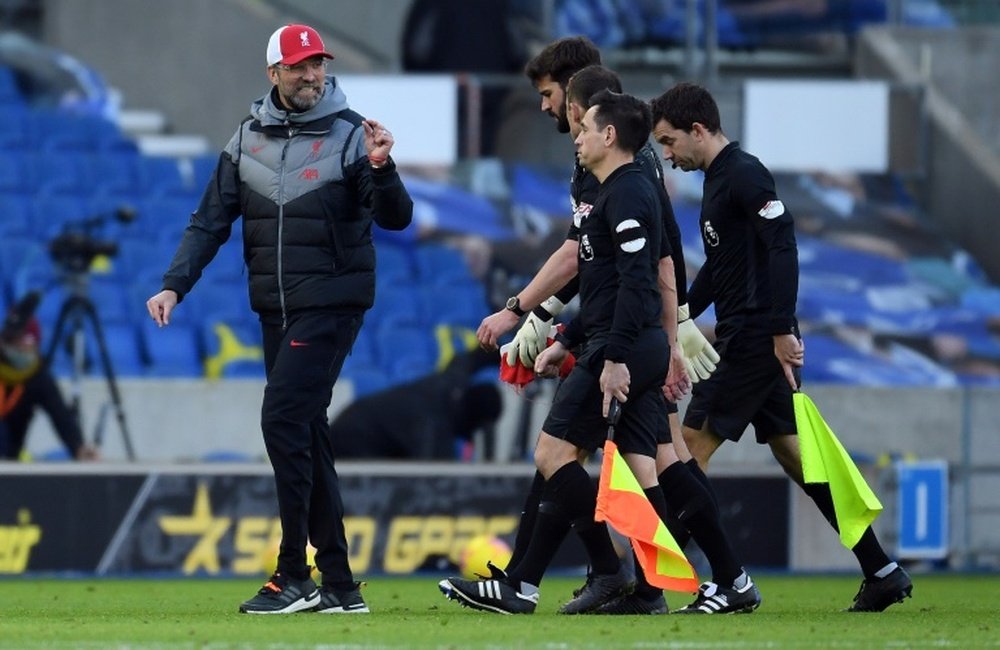 Liverpool boss Jurgen Klopp (left) was left frustrated by the fuxture schedule. AFP