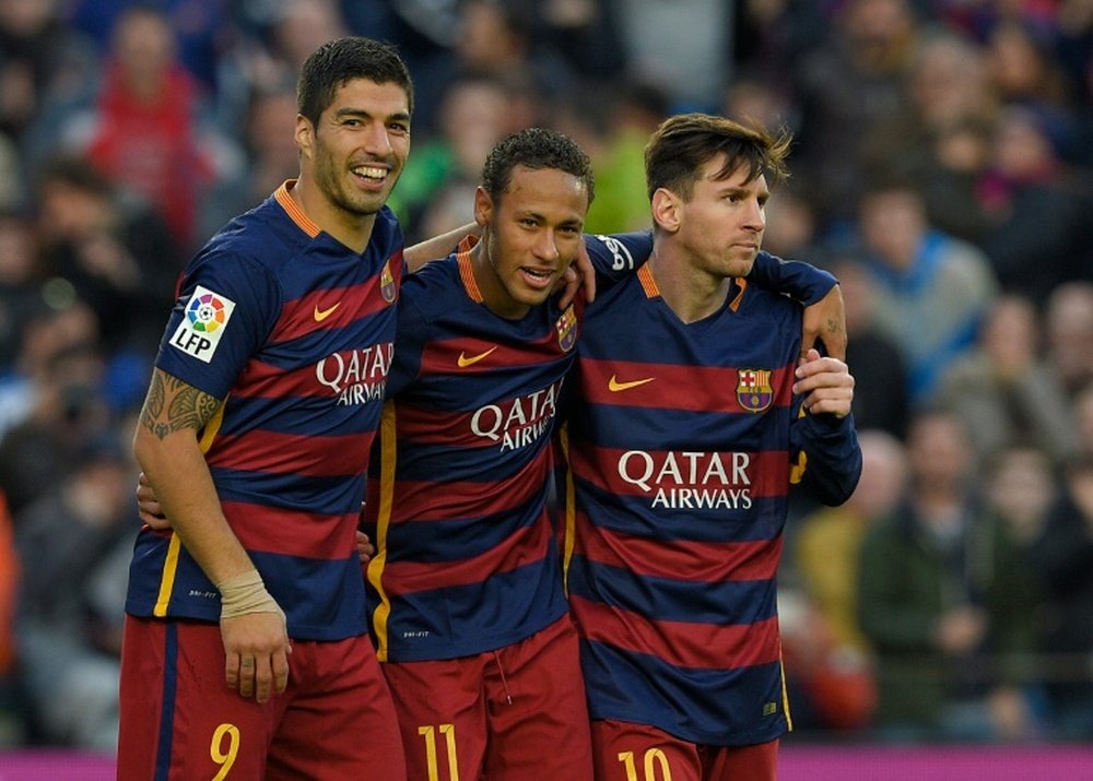 Barcelonas Neymar (C) celebrates with Luis Suarez (L) and Lionel Messi after scoring their third goal during the Spanish league football match FC Barcelona vs Real Sociedad de Futbol at the Camp Nou stadium in Barcelona on November 28, 2015