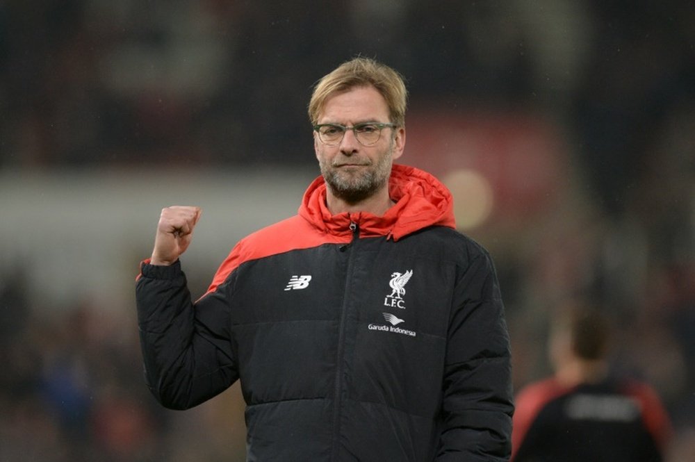 Liverpools manager Jurgen Klopp gestures during the warm up ahead of the English League Cup semi-final first leg football match at Britannia Stadium in Stoke-on-Trent, central England, on January 5, 2016