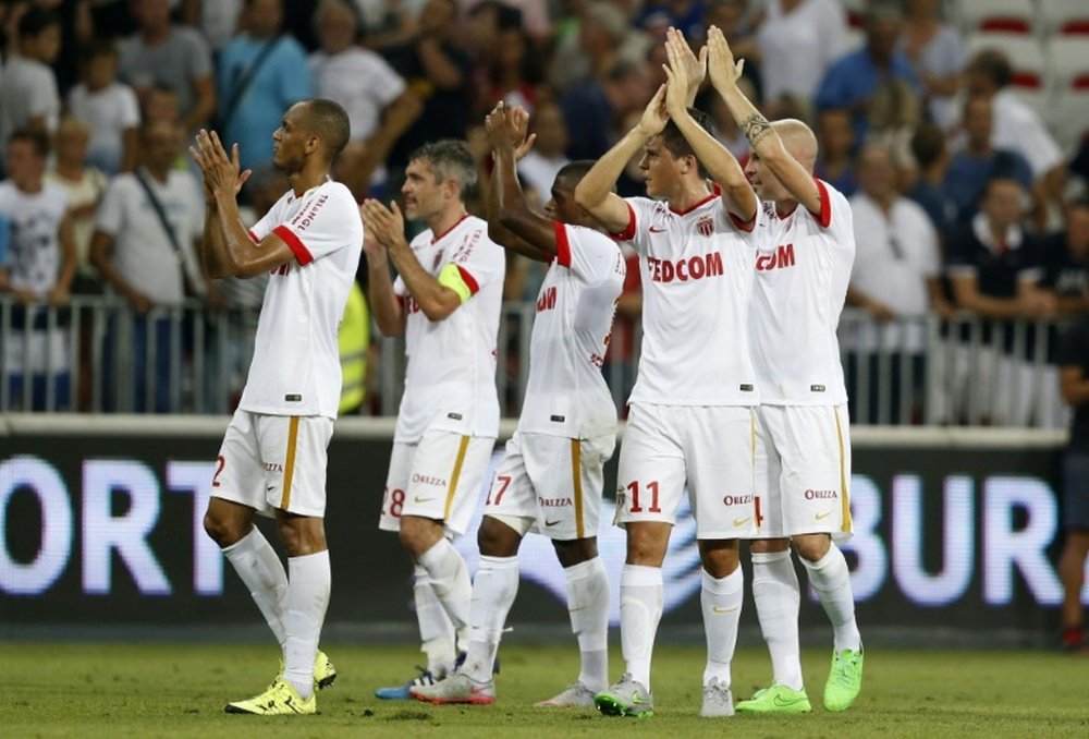 Monacos players celebrate at the end of the French L1 football match between Nice and Monaco at the Allianz Riviera stadium in Nice, southeastern France, on August 8, 2015