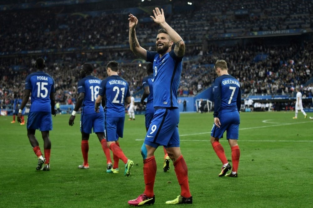 Frances forward Olivier Giroud celebrates after scoring another goal during the Euro 2016 quarter-final football match between France and Iceland at the Stade de France in Saint-Denis, near Paris, on July 3, 2016