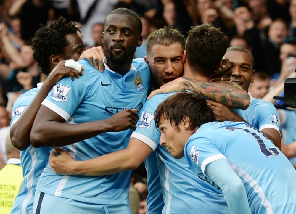 Les joueurs du Manchester City célèbrent un but en Premier League. AFP