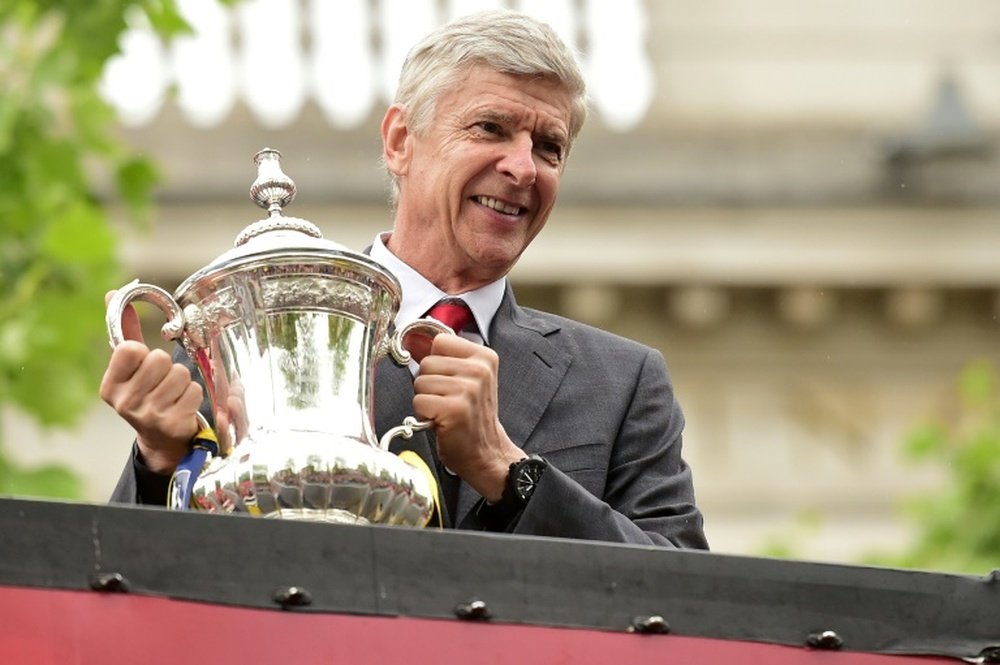 Arsene Wenger happy after winning the FA Cup with Arsenal. AFP