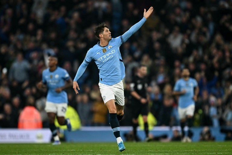 Stones scored a stoppage-time equaliser in Manchester Citys 2-2 draw with Arsenal. AFP