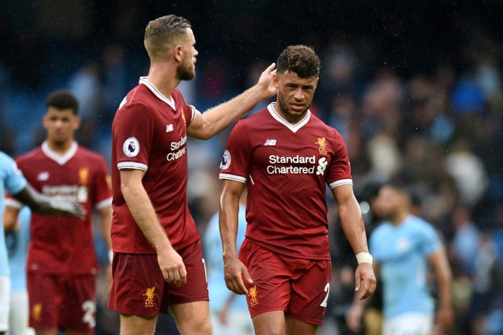 Oxlade-Chamberlain (right) is yet to make his first Liverpool start since joining from Arsenal. AFP