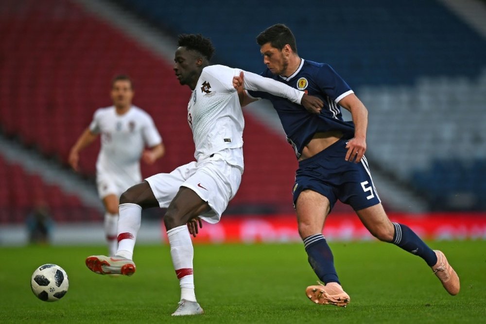 Scott McKenna be on his way to Burnley. AFP