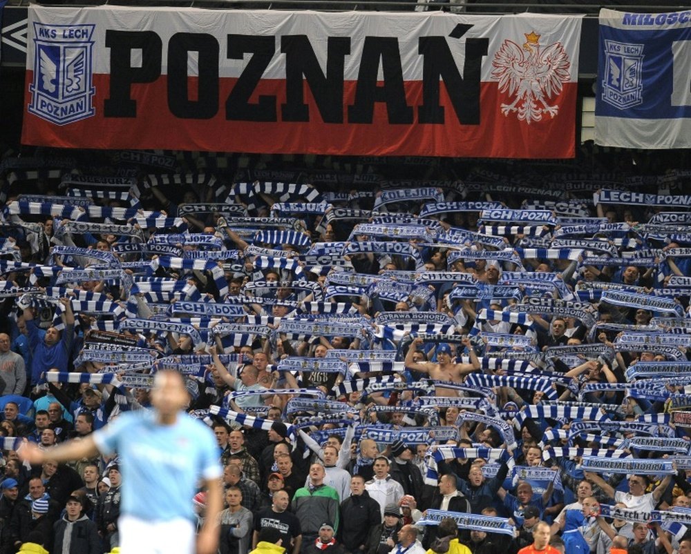 Lech Poznan fans cheer their team during the UEFA Europa League group A football match against Manchester City at The City of Manchester stadium, Manchester, England on October 21, 2010