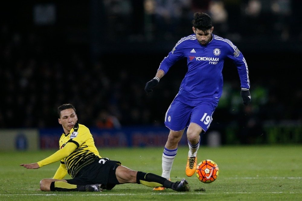 Chelseas striker Diego Costa (R) jumps over a tackle from Watfords midfielder JosÃ© Holebas (L) during the English Premier League football match in Watford, north of London on February 3, 2016