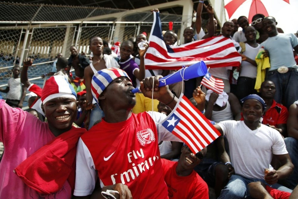 A Liberian supporter blows a vuvuzela horn during the 2014 FIFA World Cup qualifying football match Liberia vs Senegal on June 16, 2013 at the Samuel K. Doe Sports Complex in Monrovia