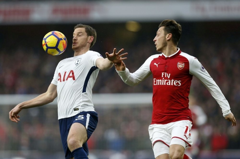 Ozil in action for Arsenal during their 2-0 win over Tottenham. AFP