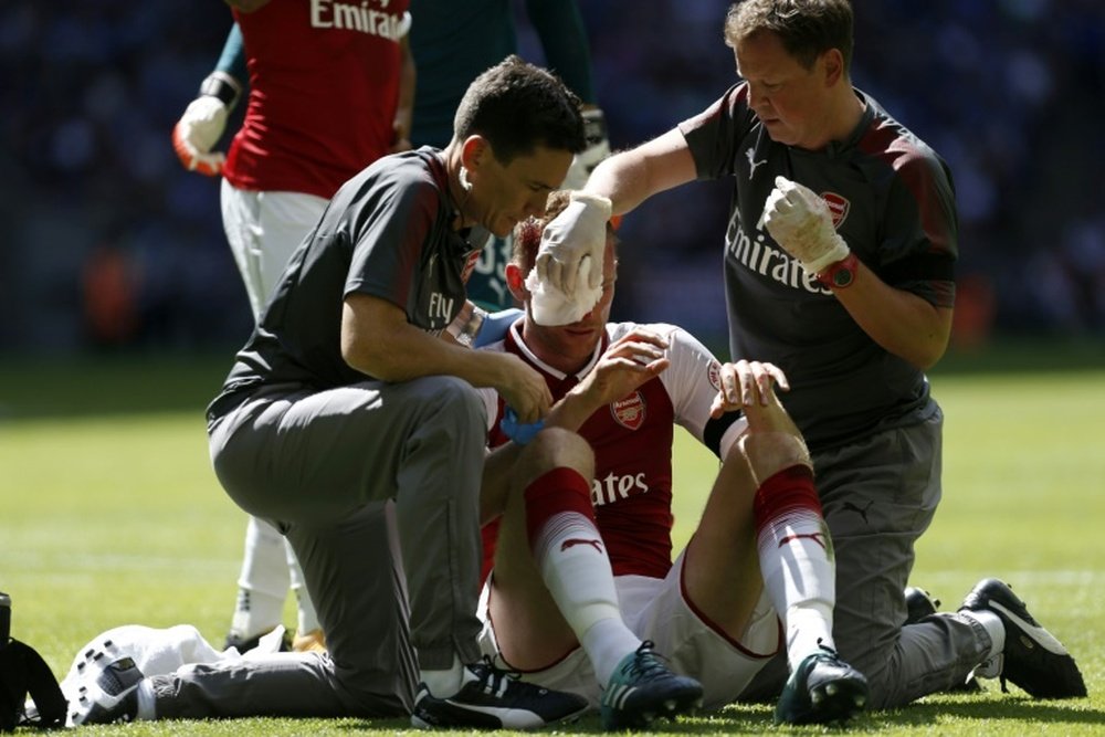 Mertesacker could not continue after clashing with Cahill. AFP