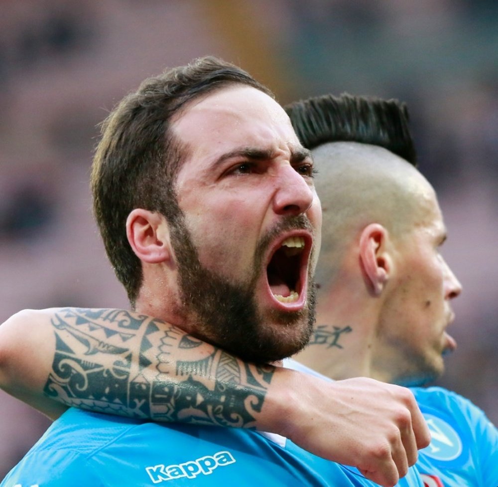 Gonzalo Higuain (left) celebrates after scoring his 24th goal in as many Serie A games