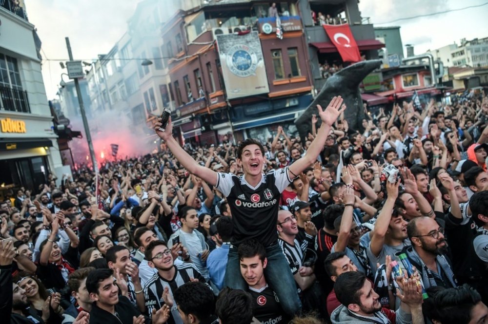 Besiktas fans celebrating the victory of the Turkish league. AFP