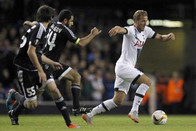 Tottenham Hotspurs English striker Harry Kane (R) vies for the ball with Qarabags Azeri defender Rashad F Sadygov during the UEFA Europa League Group J football match on September 17, 2015, at White Hart Lane in north London