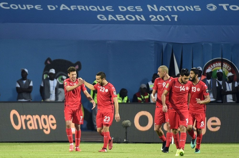 Tunisia's Naim Sliti (C) celebrates with teammates after scoring against Algeria. AFP