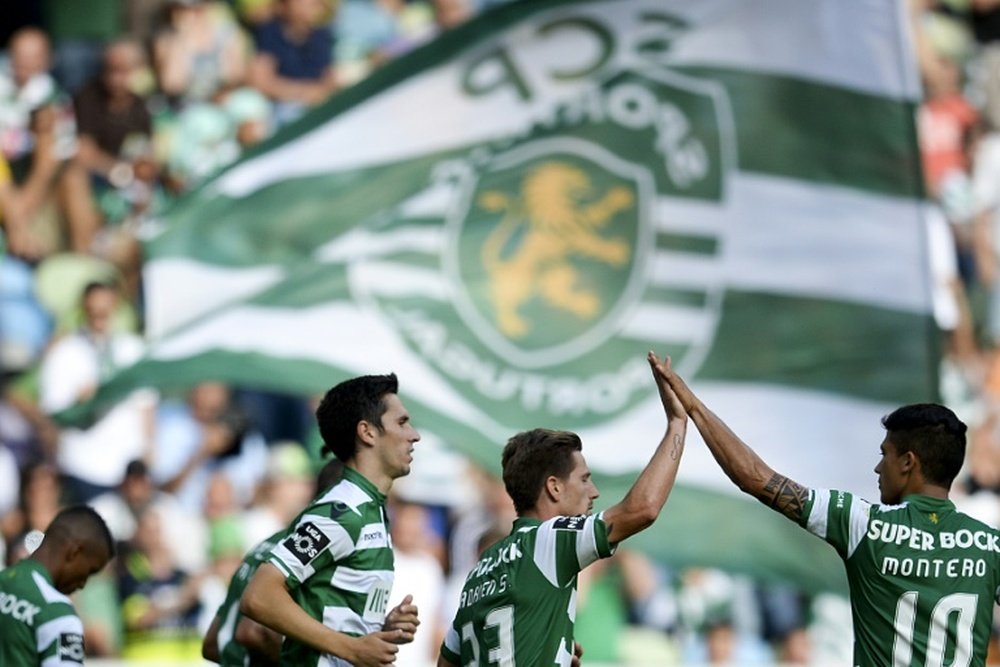 Sporting Lisbons players celebrate after scoring a goal during a Portuguese league match at the Jose Alvalade stadium in Lisbon, in May 2015