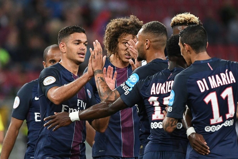 Paris Saint-Germains midfielder Hatem Ben Arfa (2ndL) celebrates with teammates after scoring on August 6, 2016
