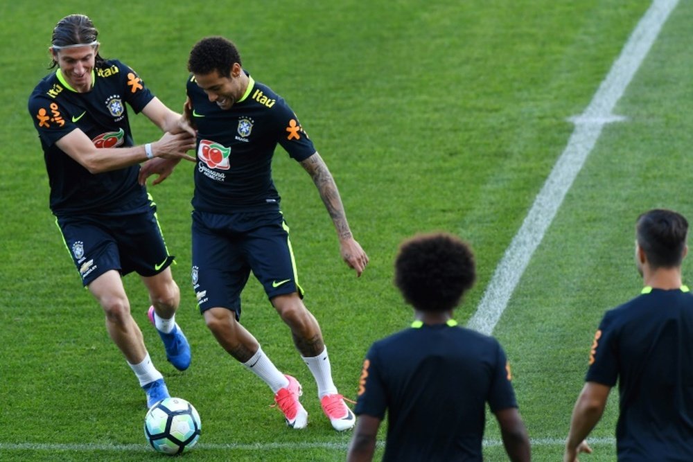 Brazils Filipe Luis (L) and Neymar take part. AFP