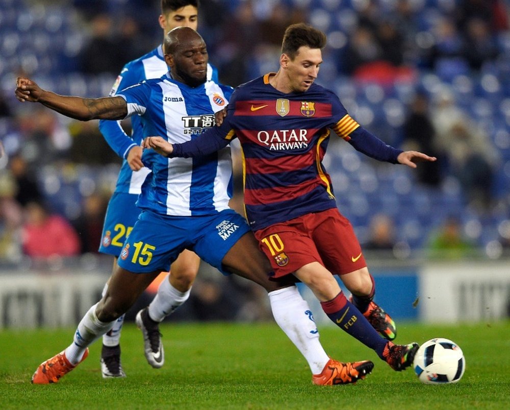 Barcelonas forward Lionel Messi (R) vies with Espanyols defender Michael Ciani (L) during the Spanish Copa del Rey round of 16 second leg football match at Cornella-El Prat stadium in Cornella near Barcelona, on January 13, 2016